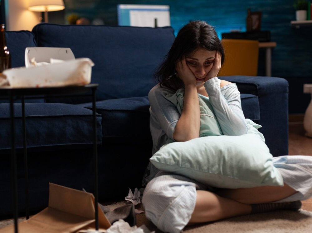 Lonely, traumatised, frustrated, ill woman holding head in hands, feeling vulnerable Lonely, traumatised, frustrated, ill woman holding head in hands, feeling vulnerable, desperate having bipolar problems, needs psychological help, major heartbroken experiencing loneliness crisis